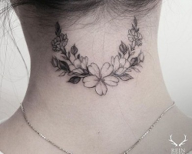 Woman’s Neck Tattoo